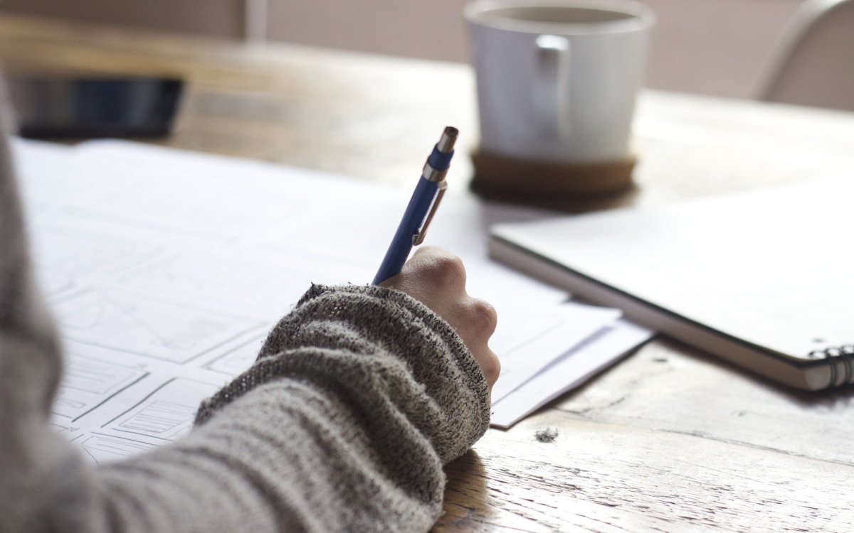 Editor drafting thought-leadership content for a client programme