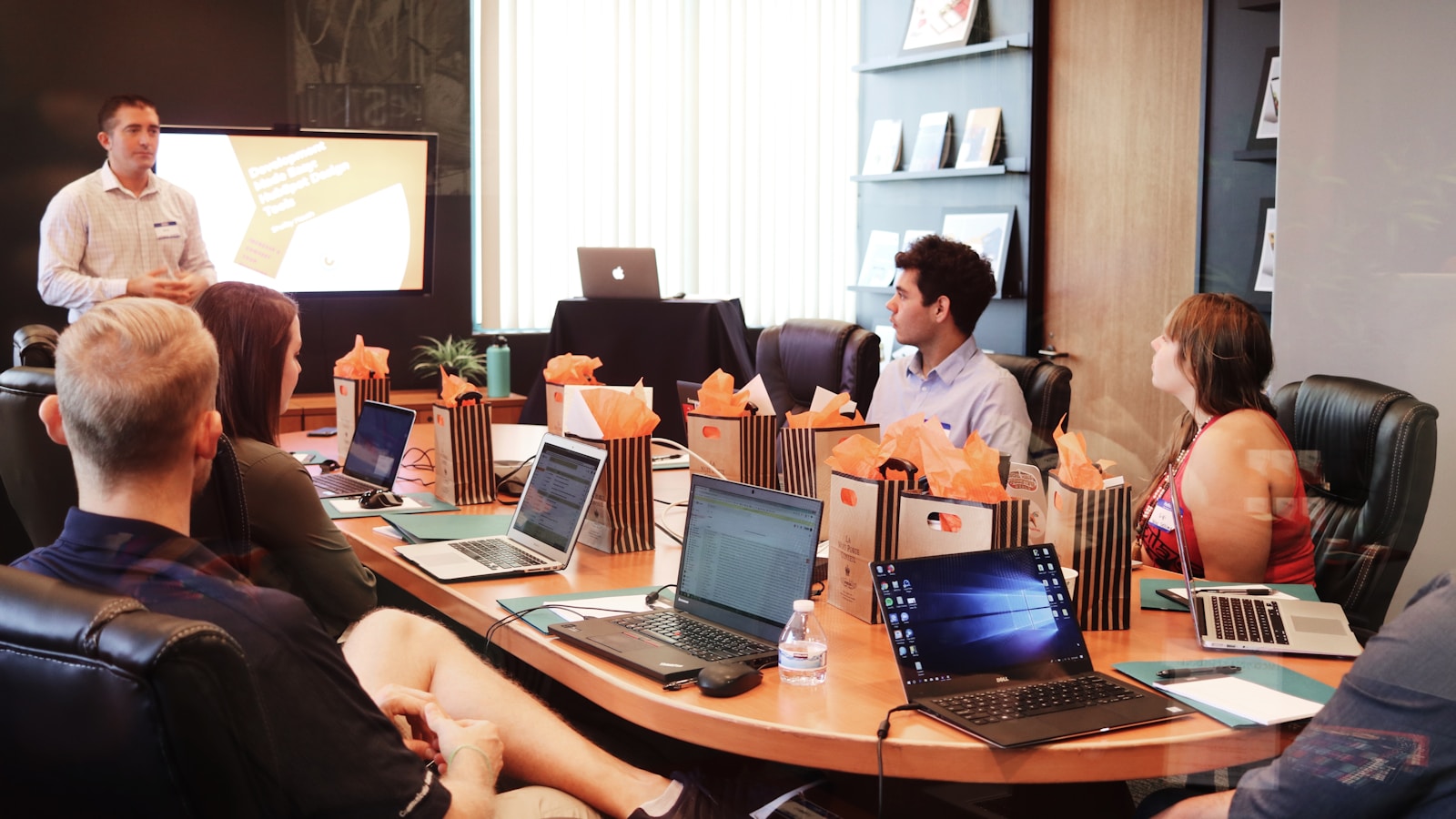 Senior communications team reviewing editorial strategy in a boardroom